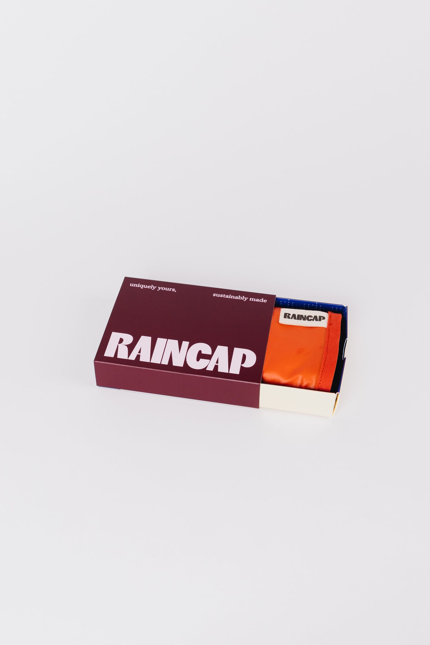 Raincap RUMI in tangerine
